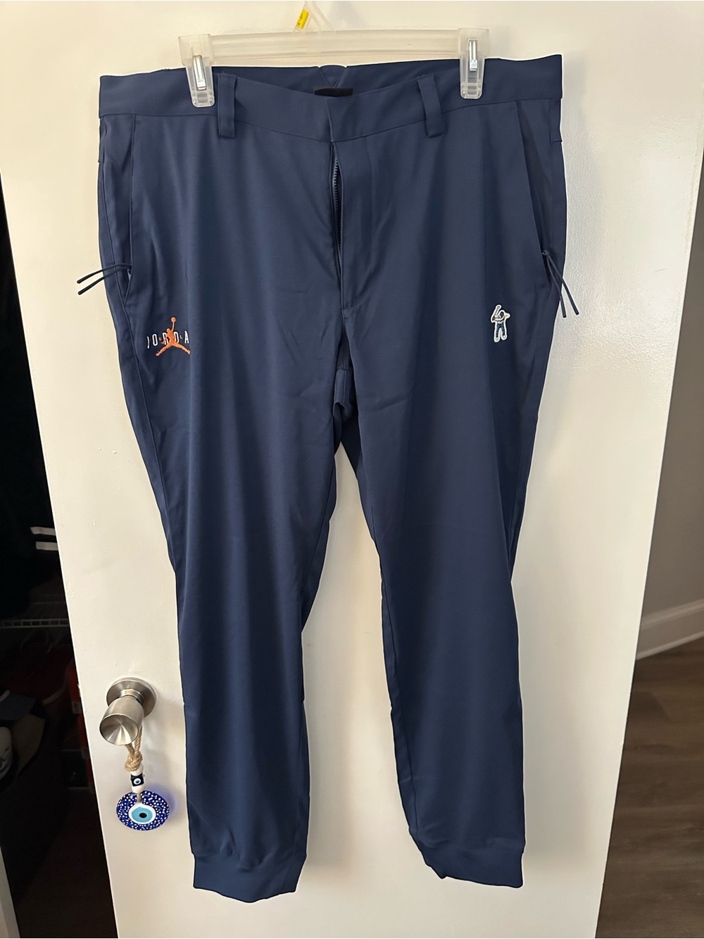 Jordan Eastside Golf Navy Joggers with Orange Jumpman Detail